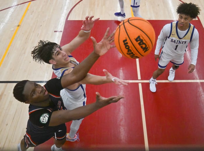 St. Augustine's Ian De La Rosa battles for a rebound against St. Francis (New York) at December's Torrey Pines Holiday Classic